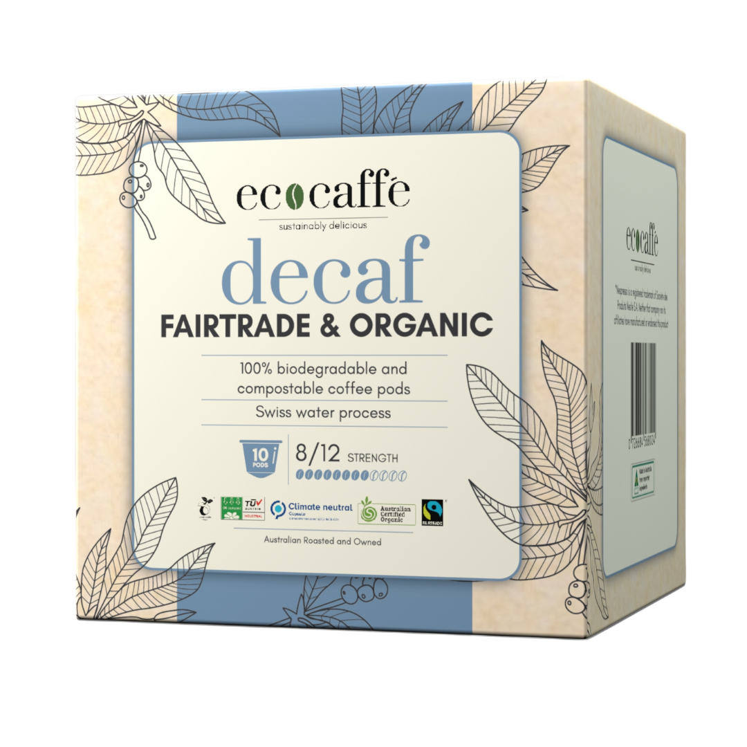 A box of EcoCaffe decaf Fairtrade and Organic coffee pods compatible with Nespresso original machines. The packaging is adorned with leaves and has product information on it.