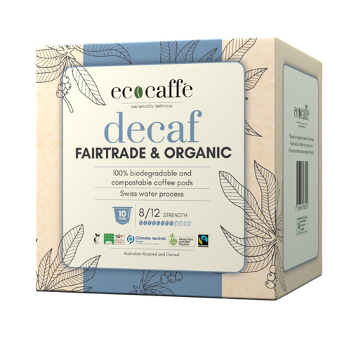 A box of EcoCaffe decaf Fairtrade and Organic coffee pods compatible with Nespresso original machines. The packaging is adorned with leaves and has product information on it.